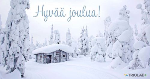 Mökki lumen keskellä, teksti "Hyvää joulua!"